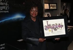 Image of Viola Davis holding her framed star gift for when she had a star named after her
